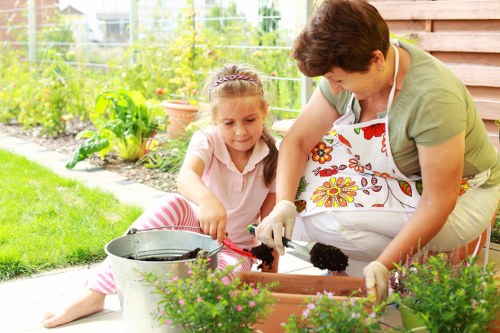 Front view of a gardener starting work in a residential garden